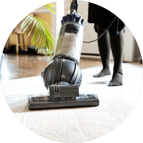 Woman Vaccuuming | Luna Flooring Gallery in Chicagoland, Oakbrook Terrace, Deerfield, Kildeer, and Naperville, IL