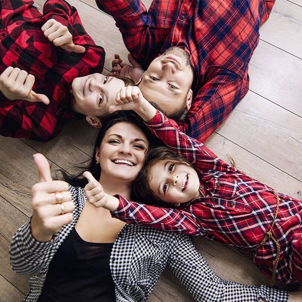 family laying on new hardwood flooring | Luna Flooring Gallery in Chicagoland, Oakbrook Terrace, Deerfield, Kildeer, and Naperville, IL